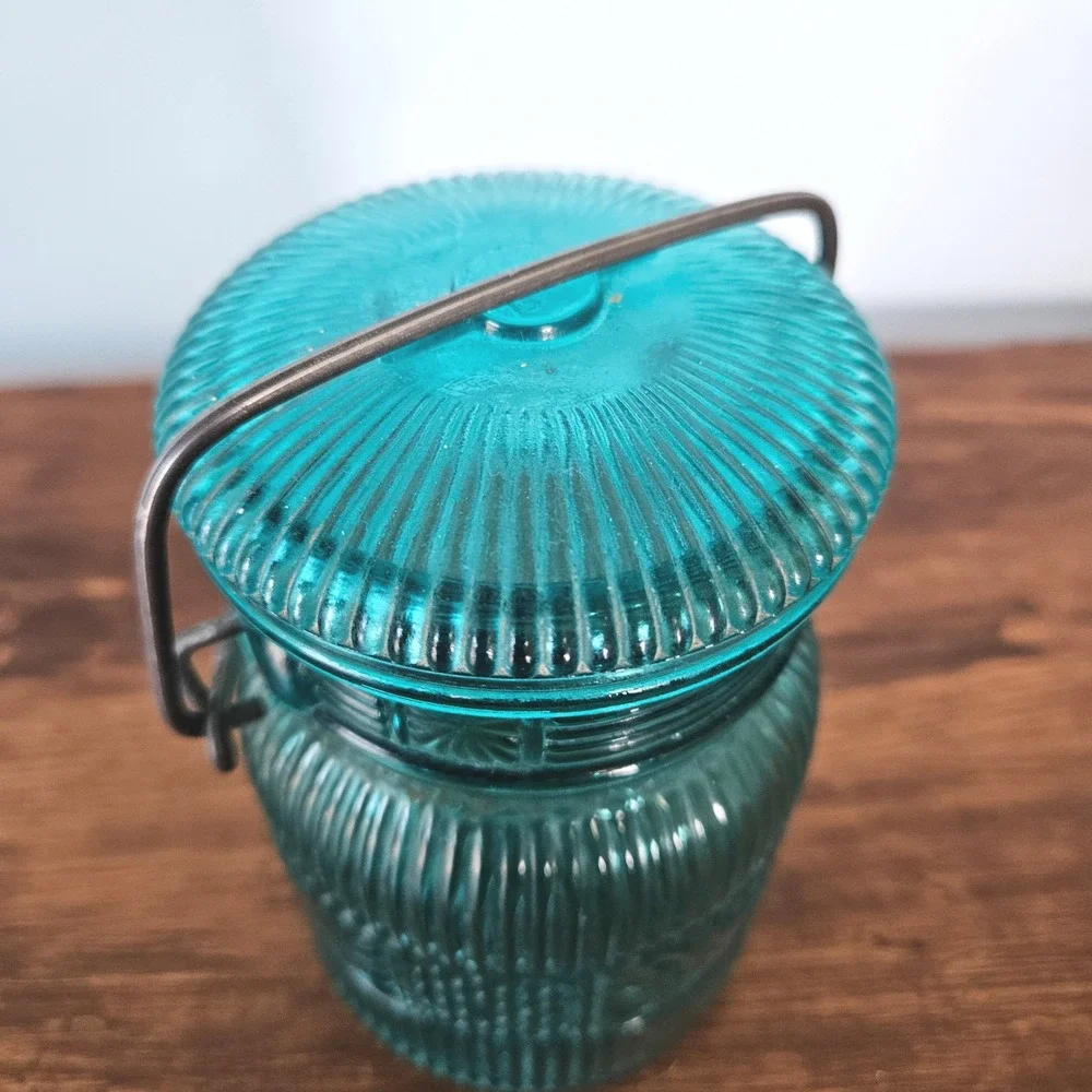 Vintage Avon Teal Blue Glass Jar Wire Bail Handle Sunburst Daisy Button Pattern